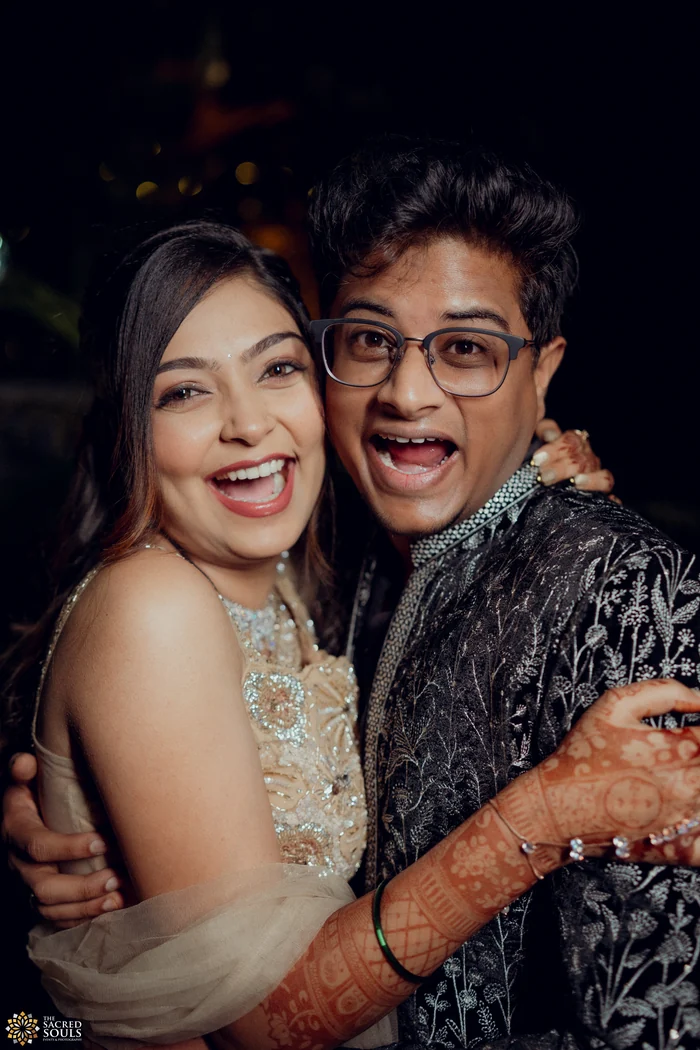 A couple laughing together at a party