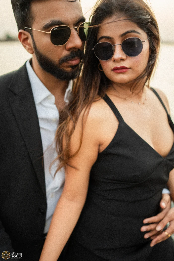 A couple in sunglasses posing together