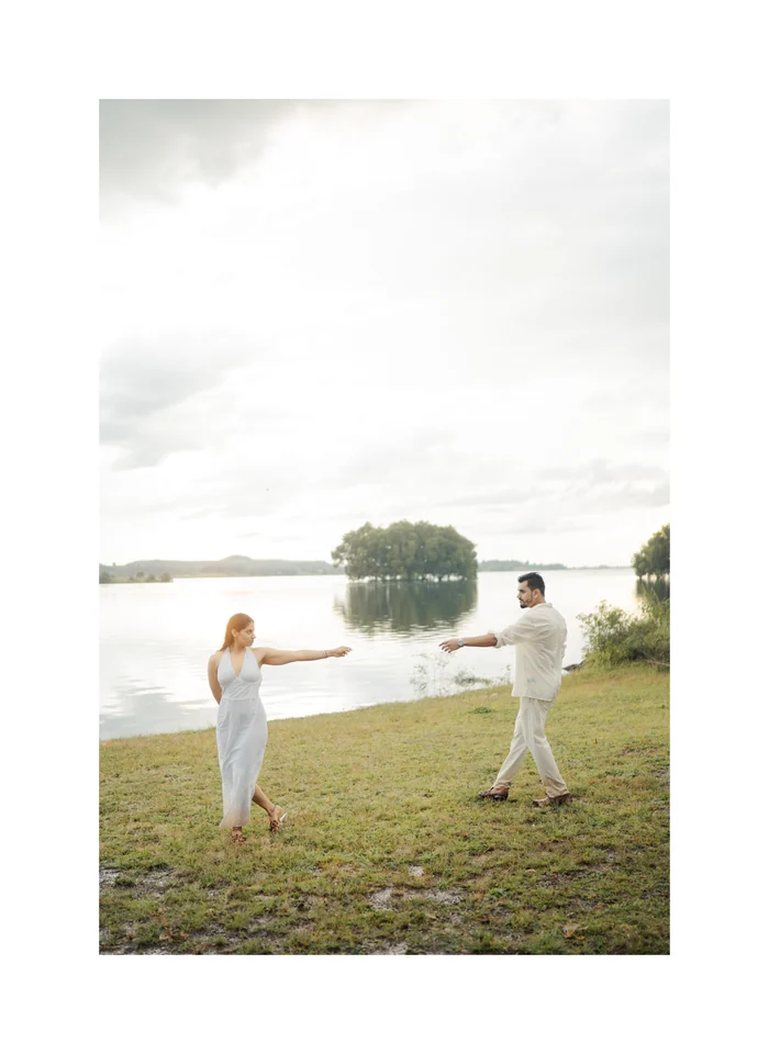 A couple dancing by a lake
