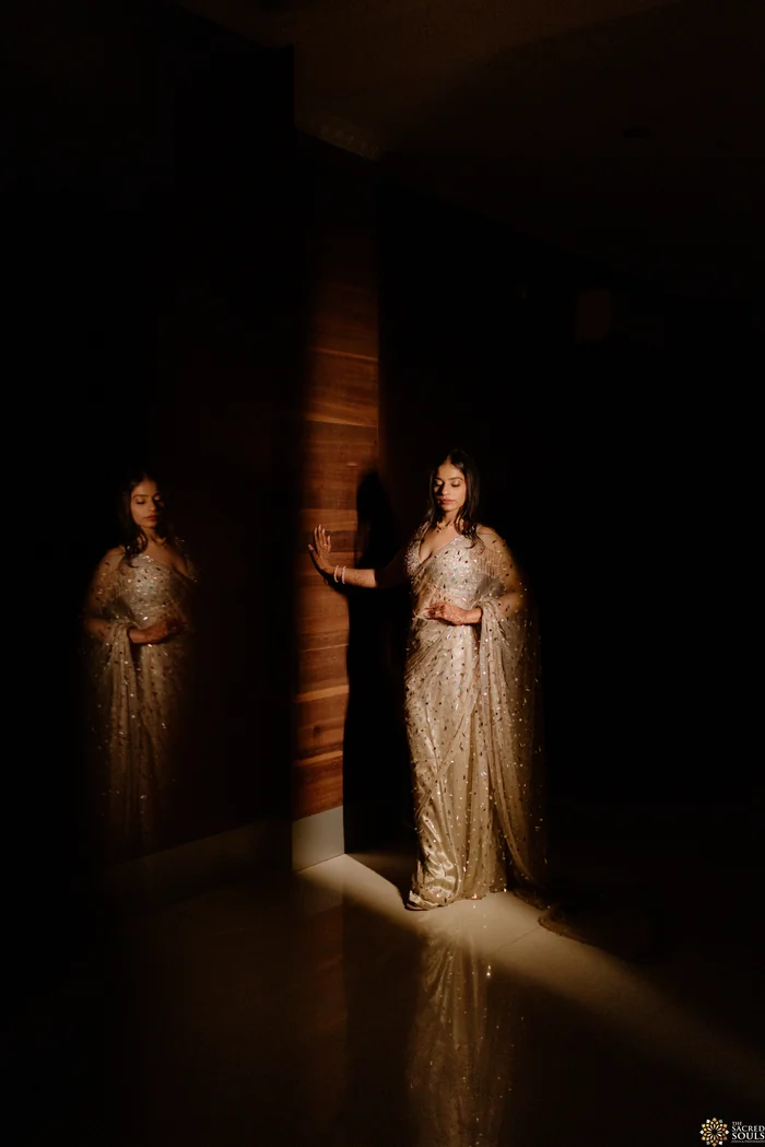 A bride standing in a dark doorway