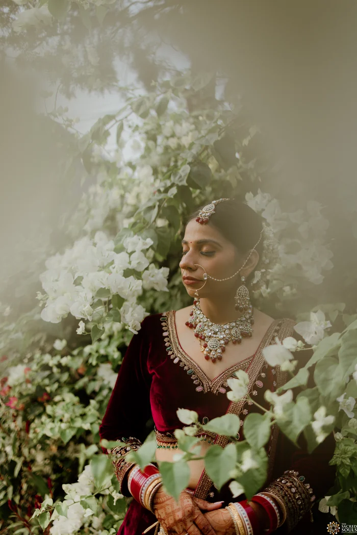 A bride surrounded by white flowers