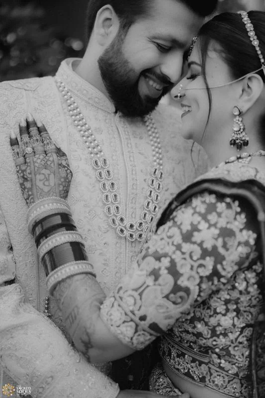 A black-and-white close-up of a couple